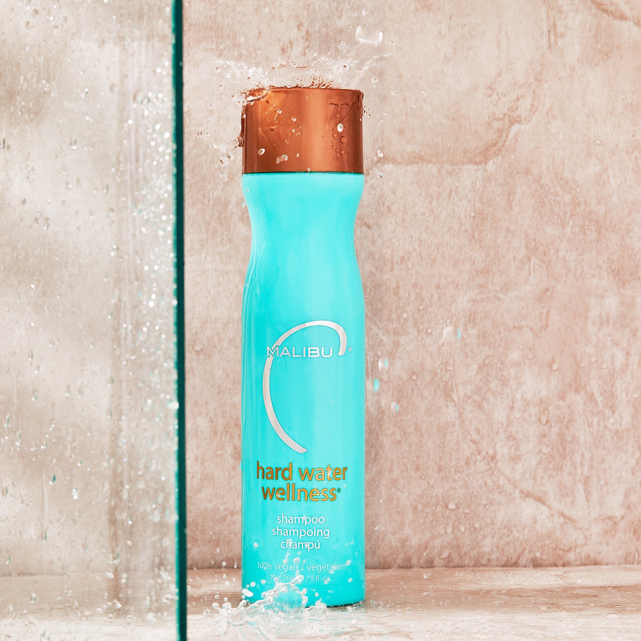 Malibu C Hard Water Wellness Shampoo with water splash